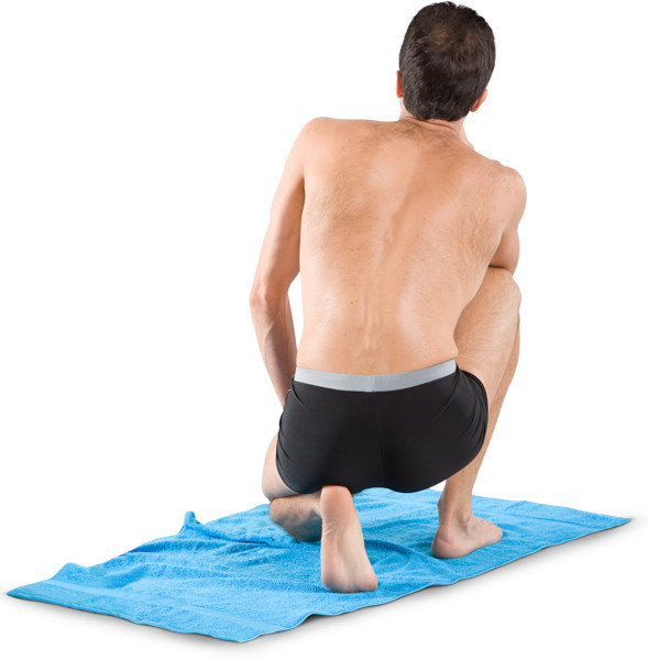 Man squats on a blanket image