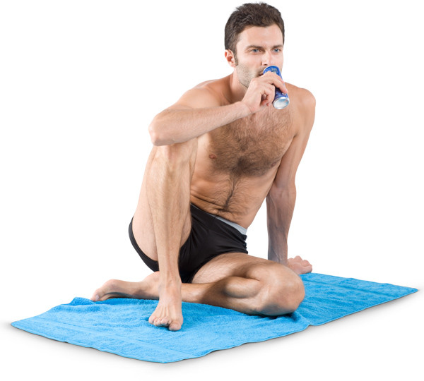 Man on the blanket is drinking image