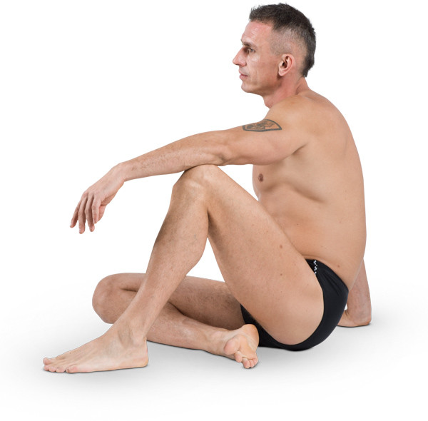 Sitting man with tatoo image