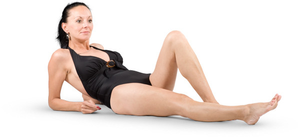 Woman lies and props on her elbows image