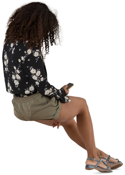 Young woman sitting and browsing the phone image