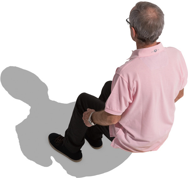 Sitting older man in polo shirt image