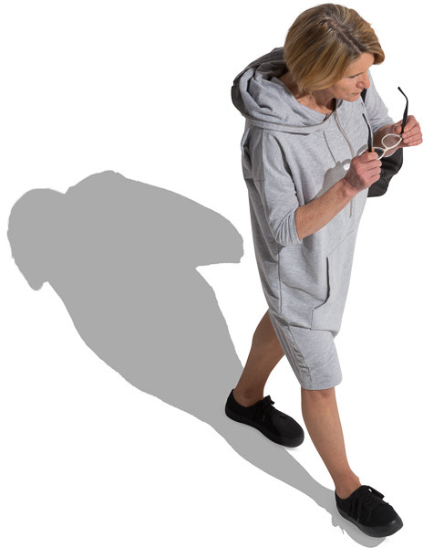 Walking woman with glasses in hands image