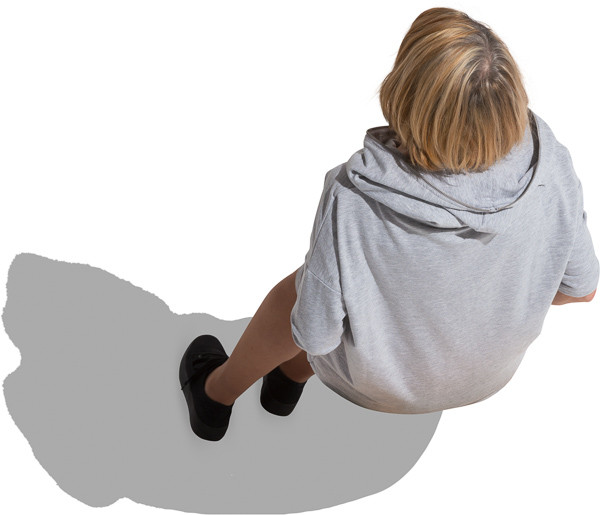 Sitting older woman in gray tunic image