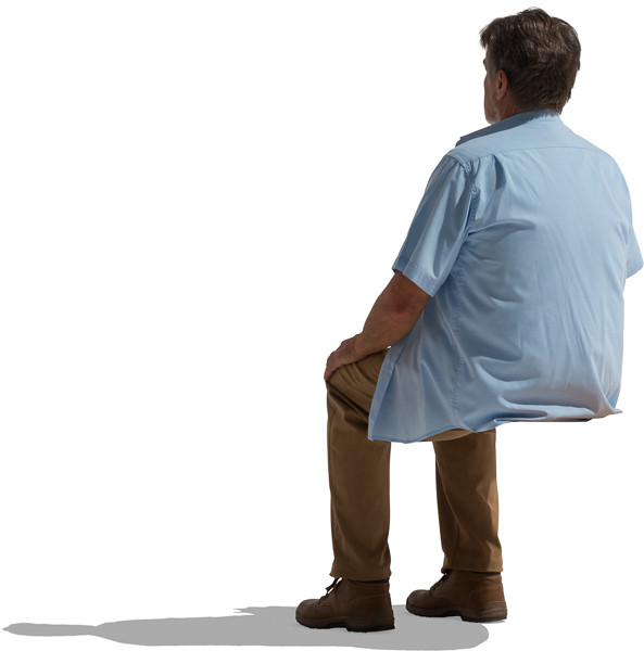 Sitting man in blue shirt image