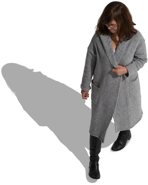 Walking mature woman in long sweater image