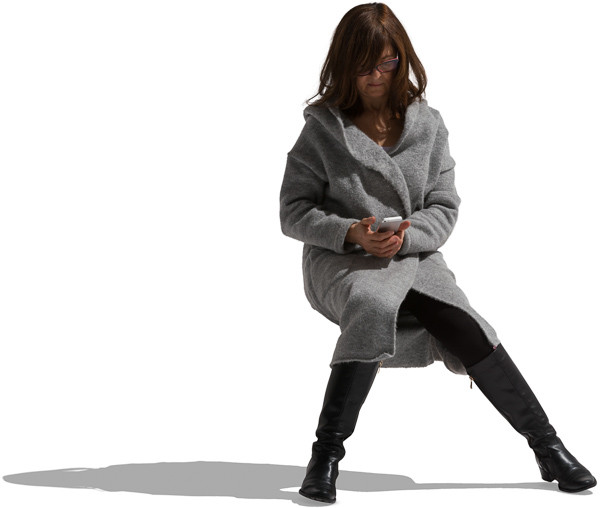Mature woman sitting in warm clothes image