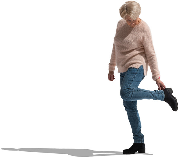 Woman in sweater corrects the shoe image
