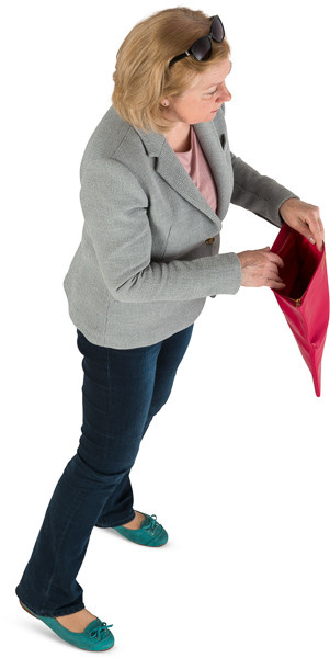 Woman pulls out of her purse image
