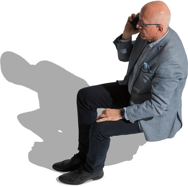 Sitting older man talking on the phone image