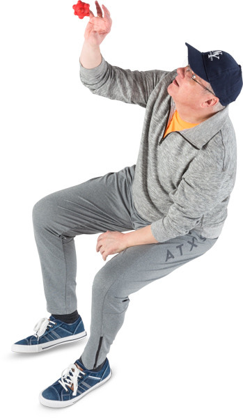 Man with red massage ball image