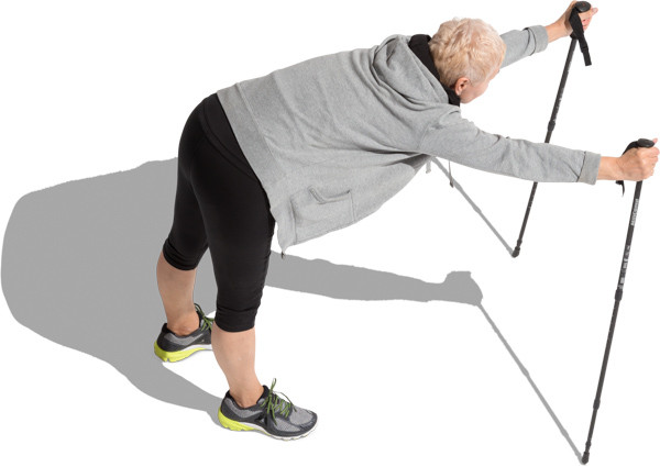 Standing senior woman with poles image