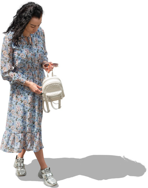 A woman in a dress looking into a bag image