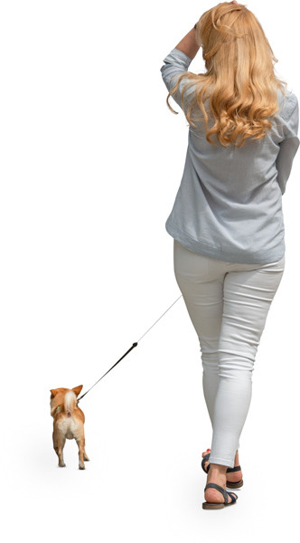 An adult woman goes for a walk with her dog image
