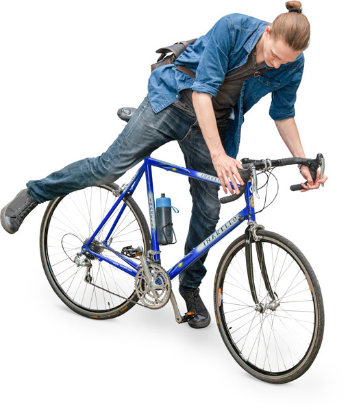 Young man getting on the bicycle image